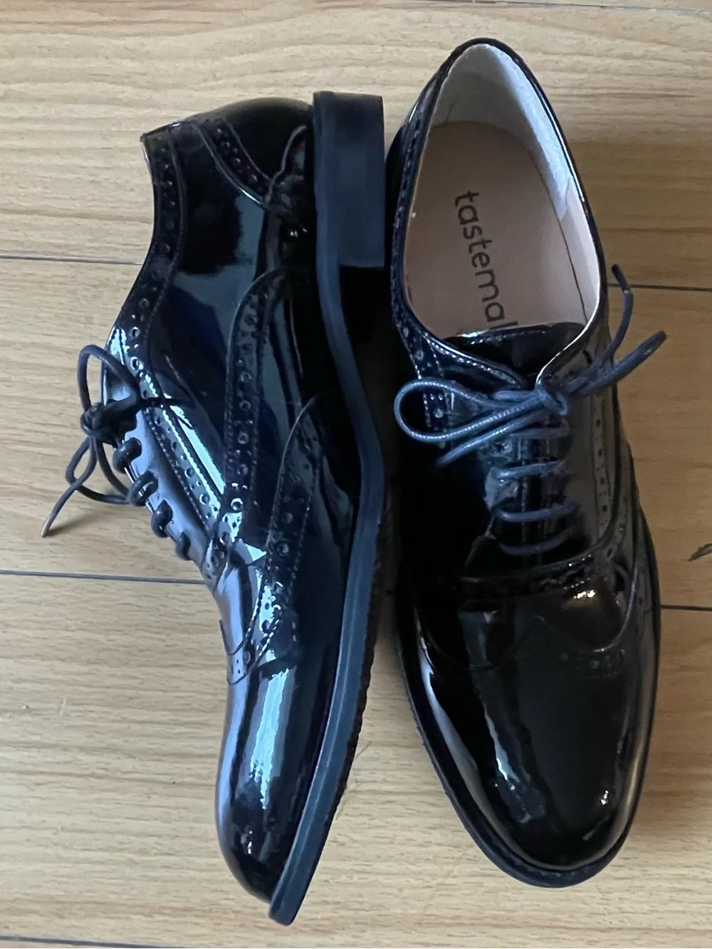 Tastemaker Women’s Black Patent Wingtip Oxfords